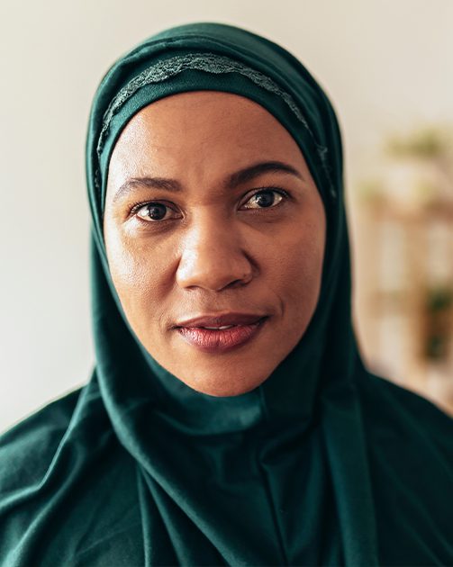 close up of woman in a hijab looking into camera