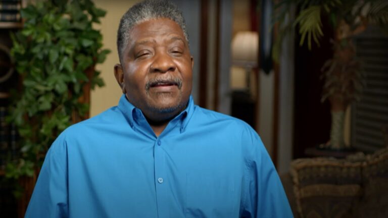 A man in a blue shirt