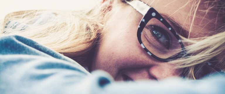 Close up of a woman in glasses