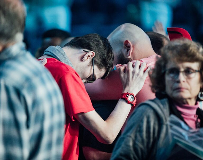 Christians Praying At Leading The Way Evangelism Event in Macon Georgia